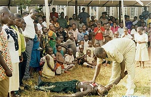 Hannington Serugga, teaching emergency first aid training class. Luweero, Uganda