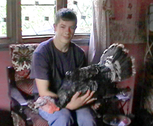 Margaret's grandson Joel Clarkson, with Pastor Ezira's future dinner.